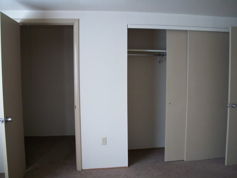 Large closet in master bedroom with an addition walk-in closet for storage. - 502 Mercer Rd