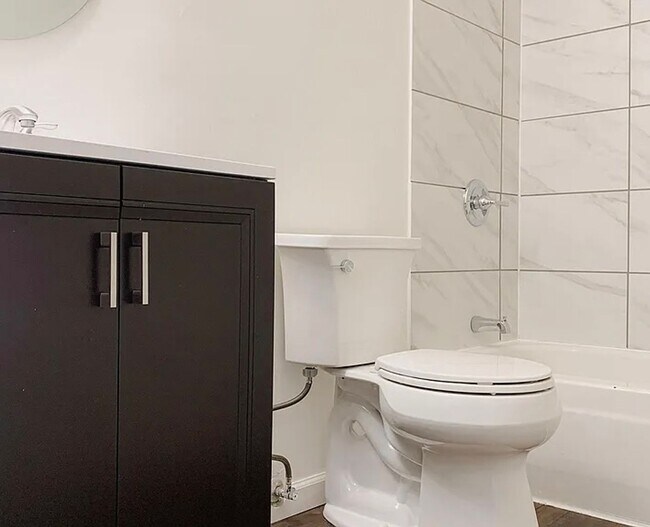 Building Photo - 4BR Tri-Level with Sunroom & Oversized Fenced Yard & 2-Car Garage!