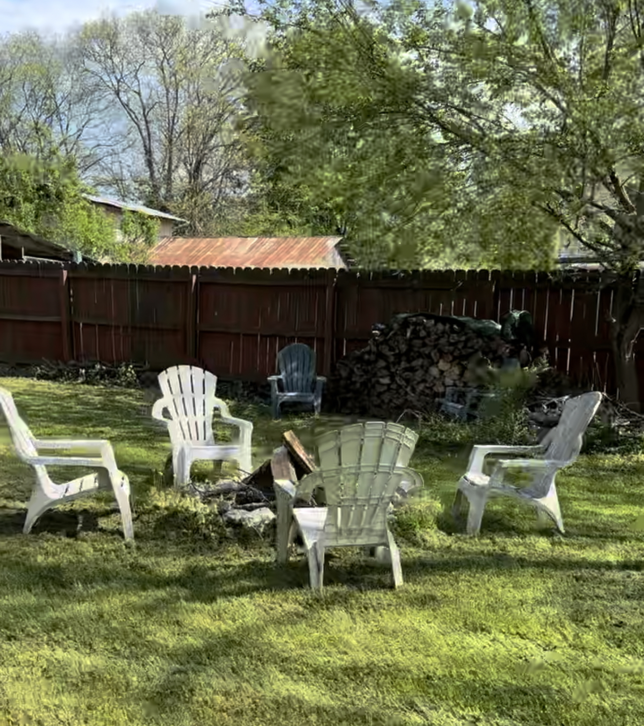 The backyard comes with a stone fire put and a year's worth of fire wood - 1148 Pierce Rd