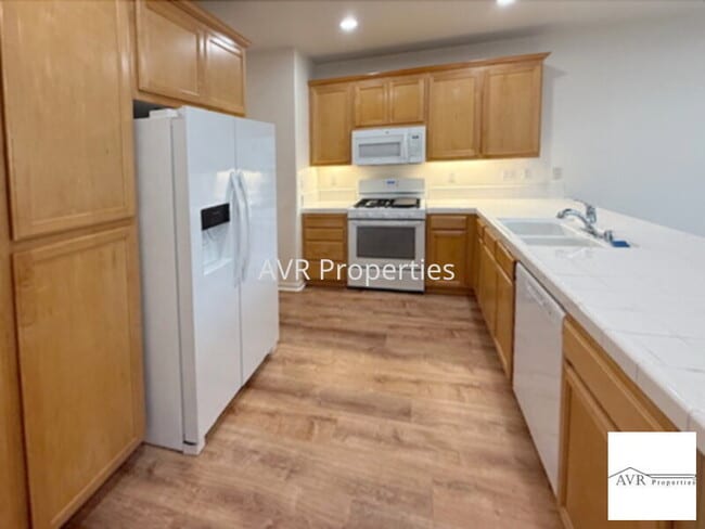 Building Photo - Spacious home with a large open concept kitchen, dining and living room