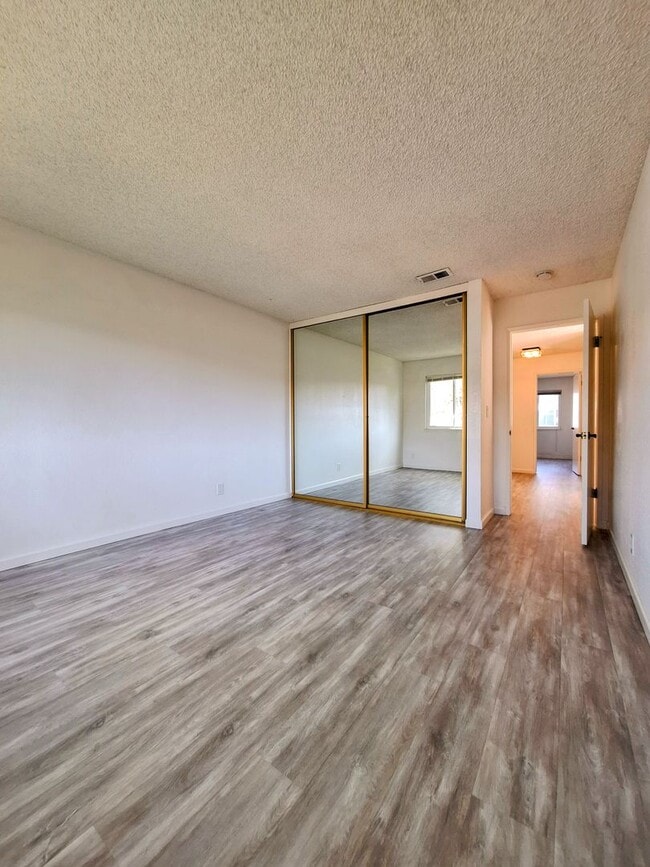 Building Photo - Spacious Two-Story 3bd Townhouse With Private Patios, Balcony, & Garage