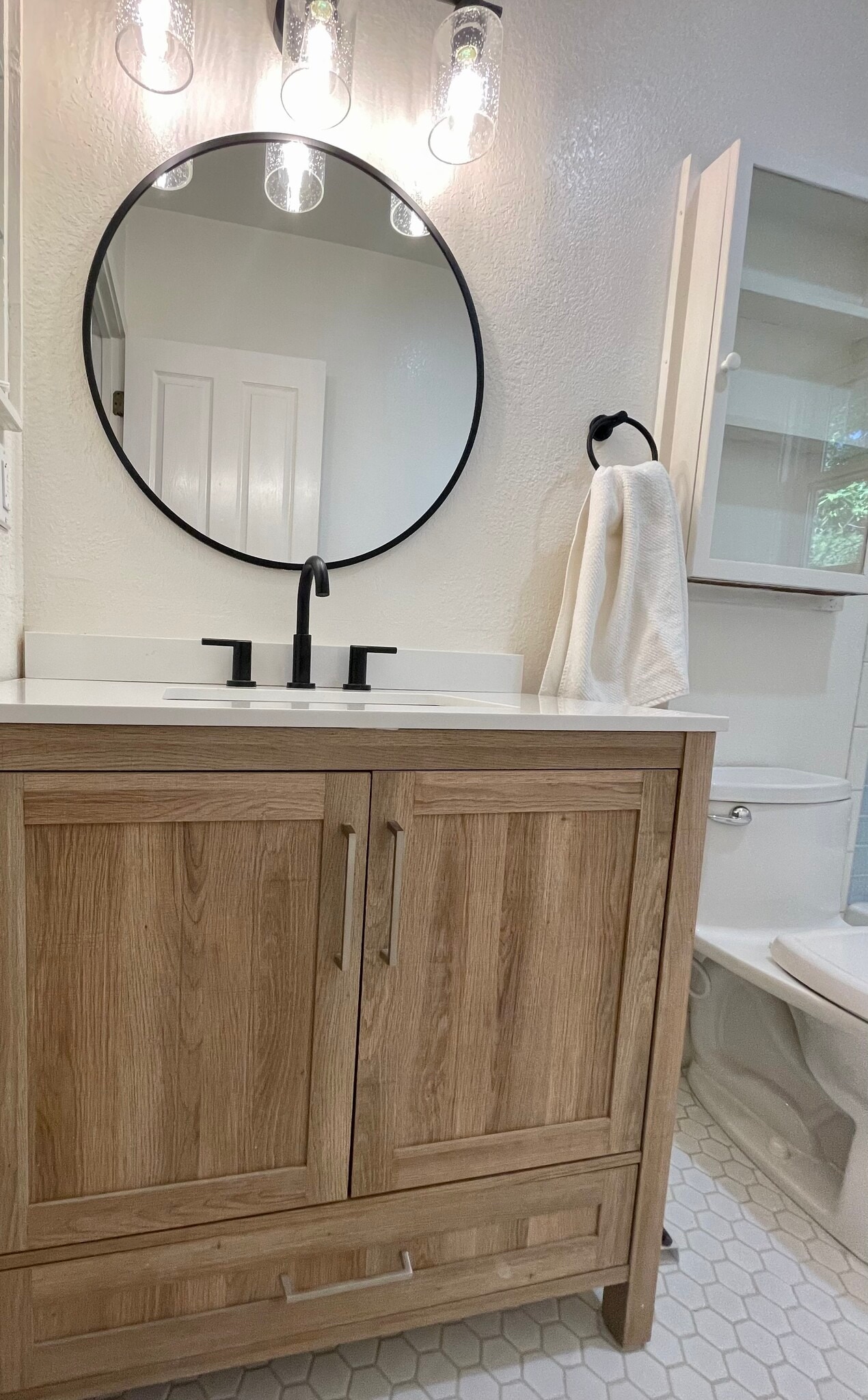Guest bath oak vanity. - 6605 Shady Lake Ln