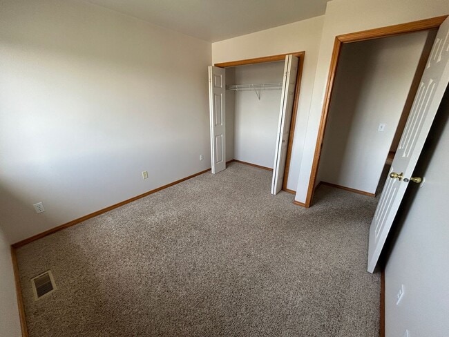 Building Photo - Three bedroom townhome with fenced backyard