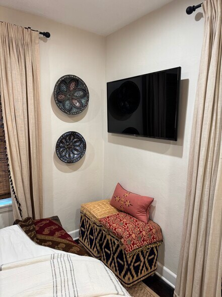 Flat screen TV in bedroom - 213 E Lakewood Rd