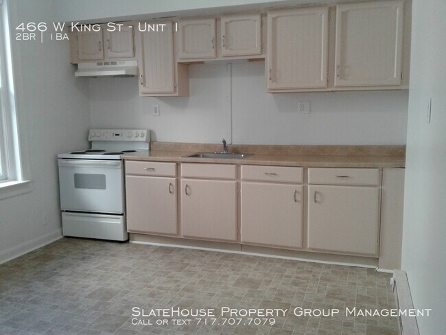 Building Photo - First floor two bedroom with yard!