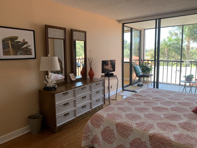 Tv in bedroom for your enjoyment area leads to lanai as well - 6219 Palma Del Mar Blvd S