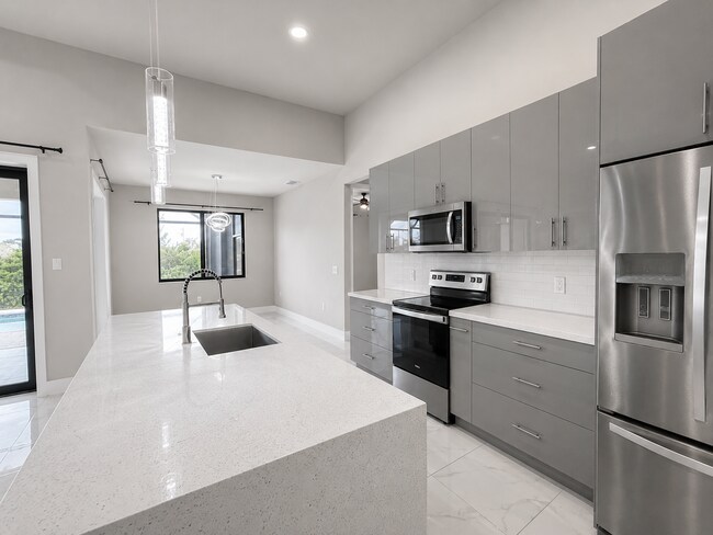 Building Photo - Move In Special! Pool Home with Canal View