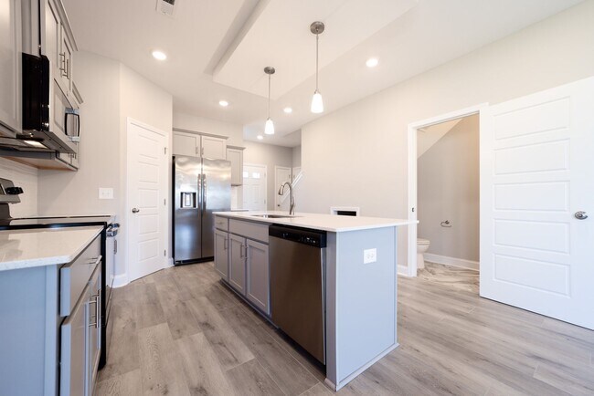 Building Photo - Elegant Home with Stone Fireplace, Kitchen Island and Designer Primary Suite