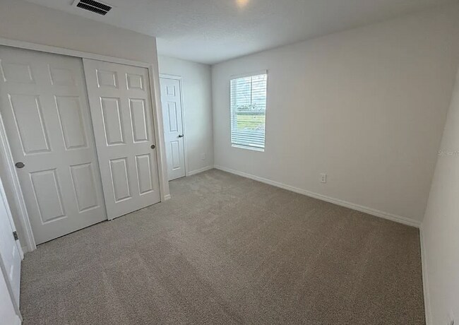 Building Photo - "Spacious 3-Bedroom Townhouse with Granite Elegance in St. Cloud – 4543 Rangeland Way"