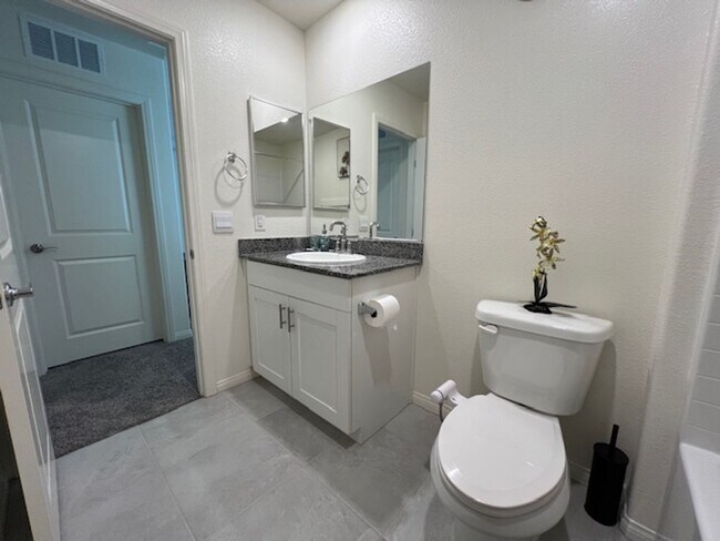Building Photo - FULLY FURNISHED!!! beautiful 3 bedroom 2 and half bath home is located in the Symmetry Bay Cadenc...
