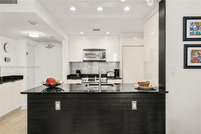 Building Photo - 10275 Collins Ave