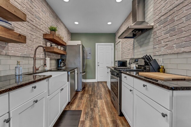 Building Photo - Furnished 1-Bedroom Lower Apartment on Main St