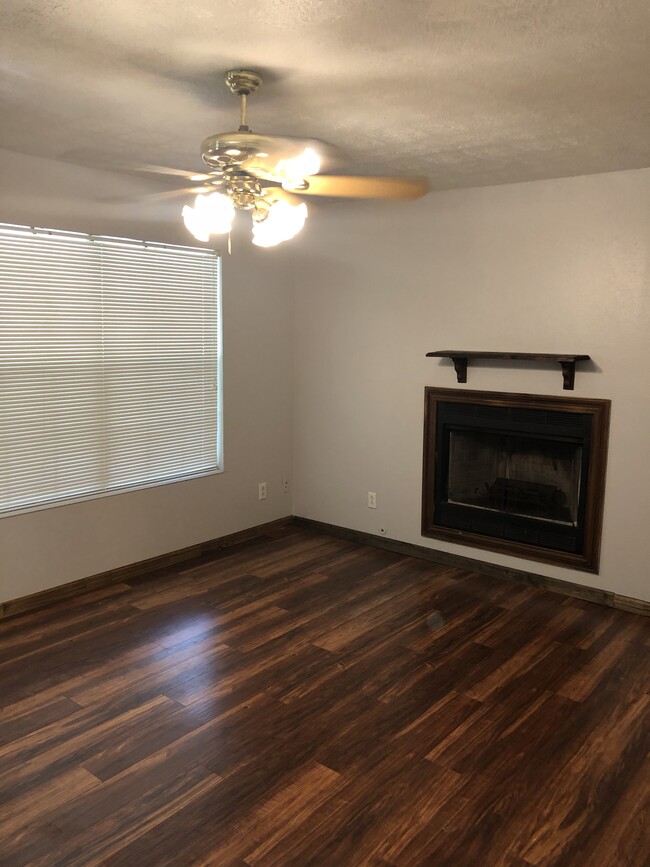 Living room with fireplace - 950 E Avenue H