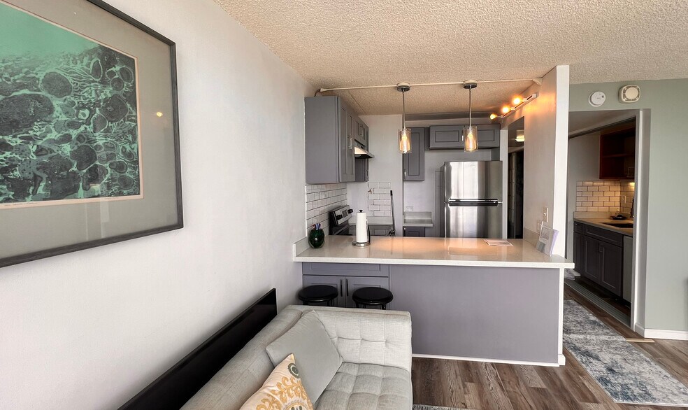 New refrigerator, cabinets, countertops, and range - 1212 Punahou St