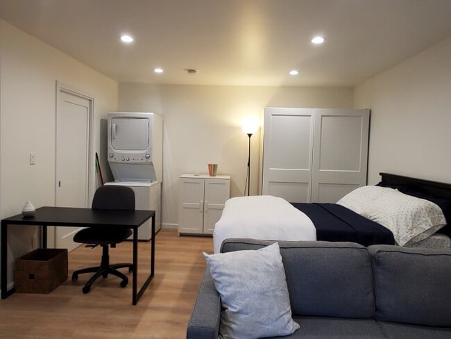 Desk/laundry/bed area - 8973 W 24th St