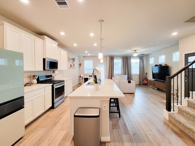 Building Photo - A true gem on a quiet corner lot, this spacious and sun-filled home is tucked away from street no...