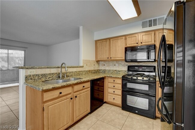 Building Photo - 5710 E Tropicana Ave