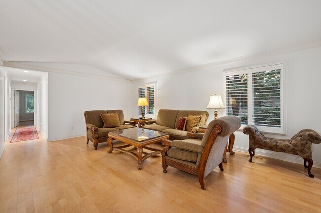 Bright space, plus plantation shutters, in the living/dining area - 145 Holly Ln N