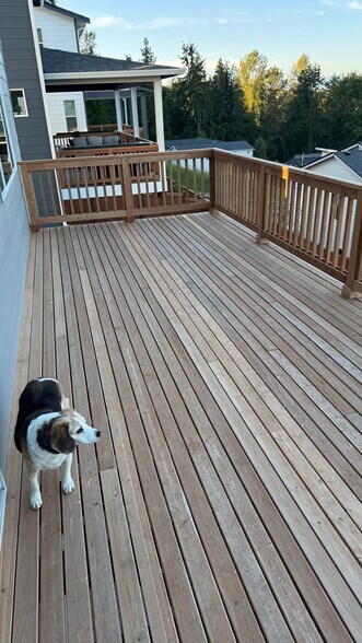 deck has extra space for large table, umbrellas, gas fire pit, BBQ, seating - 617 103rd Ct SE