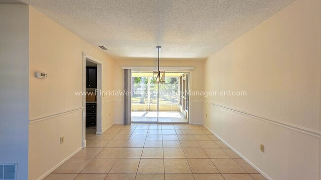 Building Photo - SPACIOUS SARASOTA HOME WITH LARGE FENCED YARD! MOVE IN READY! ALL TILE/ NEW LVP!