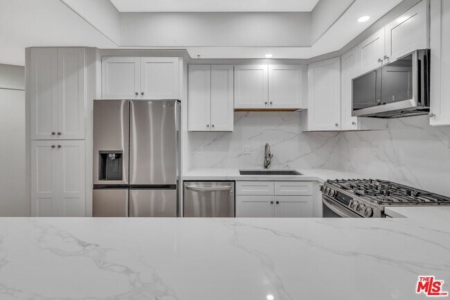 Building Photo - 4477 Woodman Ave