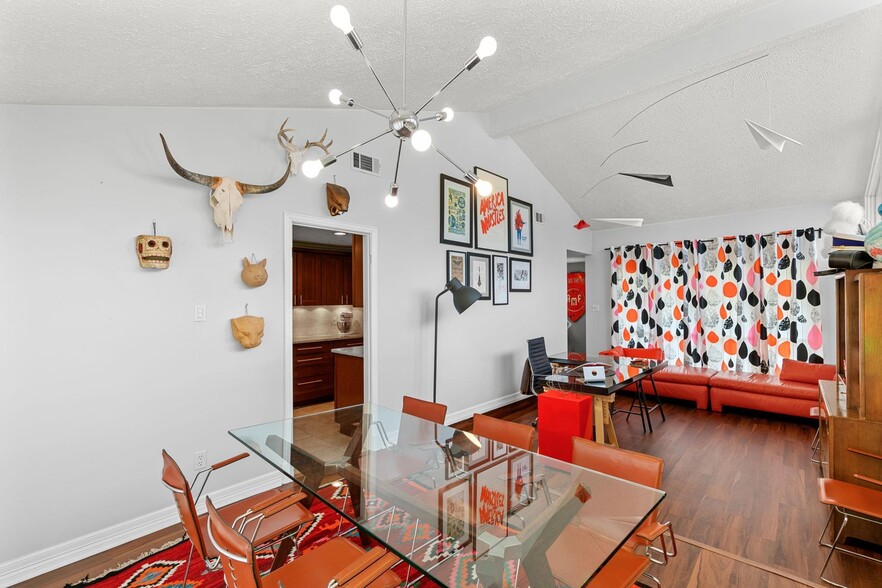 Dining room/office area with raised ceiling and tons of natural light... and paper airplane mobile! - 1178 Bournewood Dr