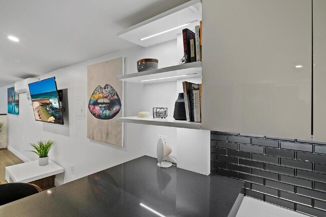 Building Photo - Live in one of San Diego’s most desirable locations in This award-winning architectural gem, "7 o...