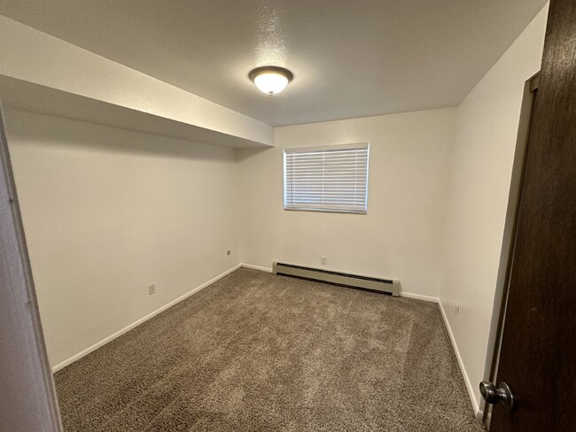 Building Photo - "Charming 3-Bedroom Condo with Hardwood Fl...