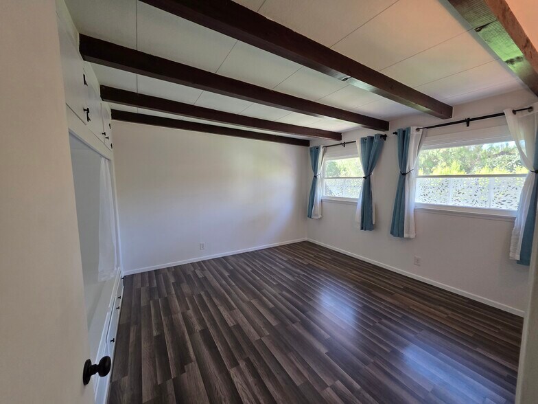 Bedroom 2 has two large windows facing back yard. - 456 E Indian Rock Rd
