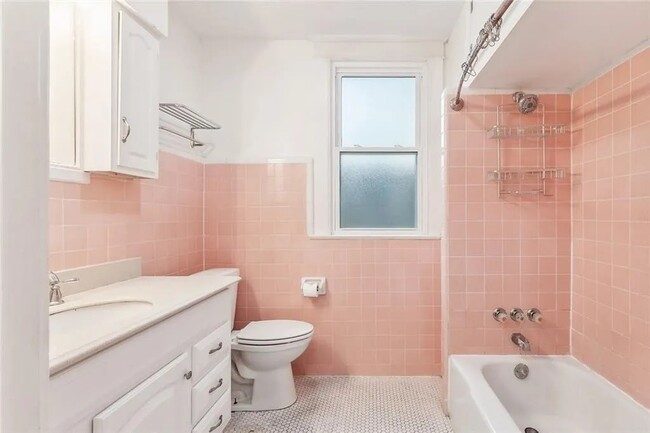 bathroom with shower and tub - 5830 S Robertson St