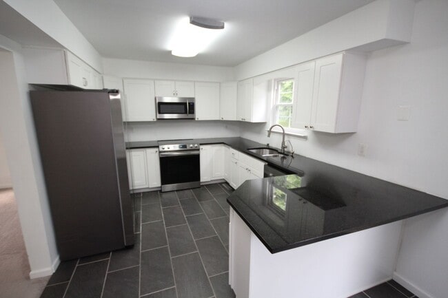 Building Photo - *Coming Soon*  Upgraded End Unit Townhome ...