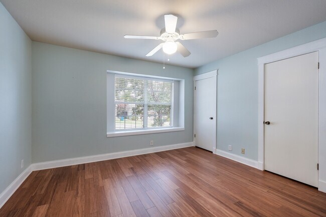 Building Photo - Modern Elegance: 3-Bedroom Townhome with Wood Flooring, Shaded Deck, and Inclusive Amenities