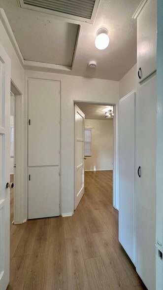 Hallway to two bedrooms, with lots of storage - 935 Sapphire St
