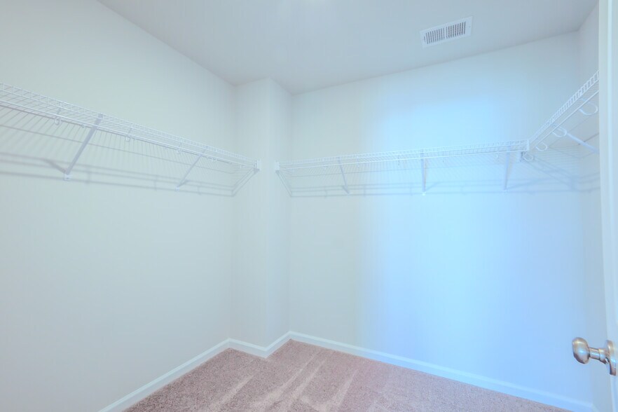 Walk-in closet in the master bedroom - 1510 Alvin Pond Dr