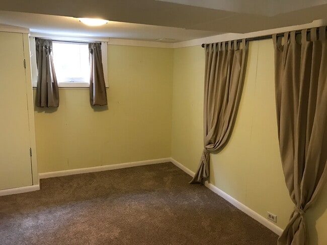 Basement bedroom with new carpet. - 3909 Perry Street