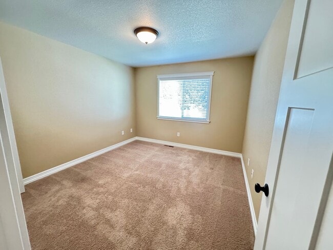 Building Photo - 4 BEDROOM, 3 BATHROOM TWINHOME WITH 2 CAR ATTACHED GARAGE IN NORTH CHEYENNE