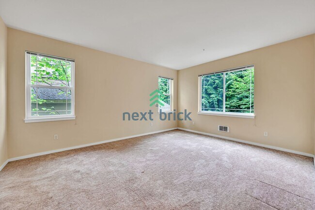 Building Photo - Rare Ground-Floor, End Unit with massive b...