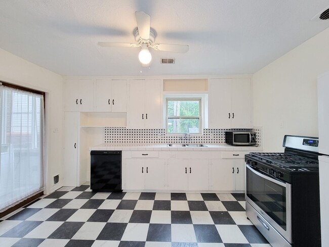 Building Photo - Step into your new home nestled in the vib...
