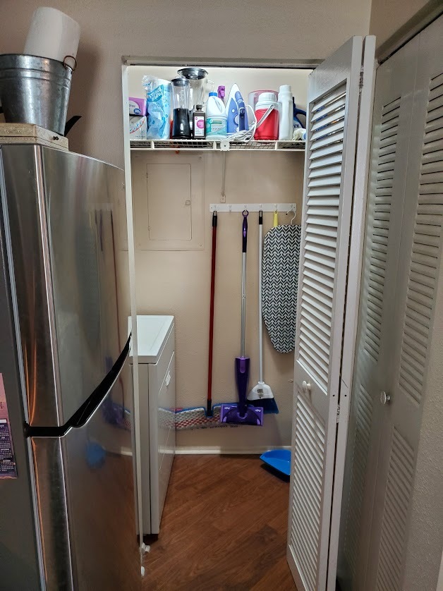 Laundry closet with shelves - 115 112th Ave NE