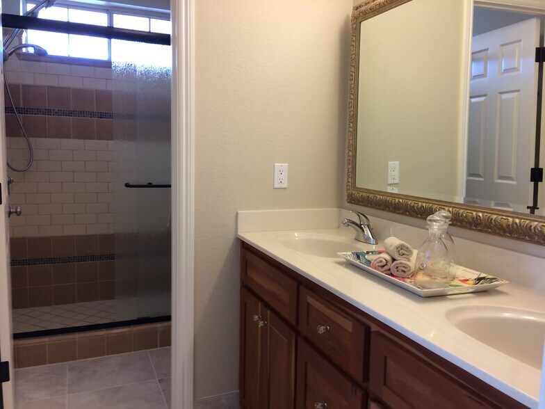 Master bath with tiled shower and floor. - 203 Bean Creek Road