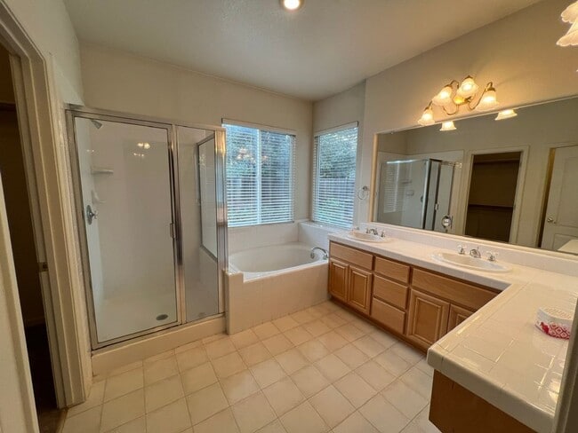 Building Photo - 4 bedrooms with 3 car garage in Rose Lane ...