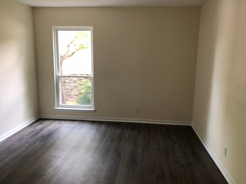 Bedroom. All windows in this unit are modern vinyl tilt for easy cleaning from inside the condo. - 515 Basswood Ave