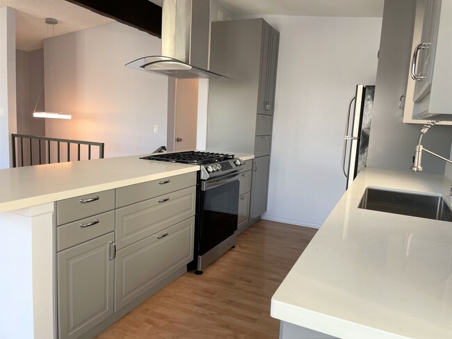 Another angle of the new kitchen cabinets - 419 Longfellow Ave