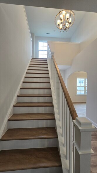 Staircase to 2nd floor which lands on an open loft - 55 Paper Birch Trl