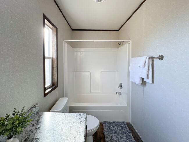 Primary Bathroom full shower/tub combo. - 615 San Rafael