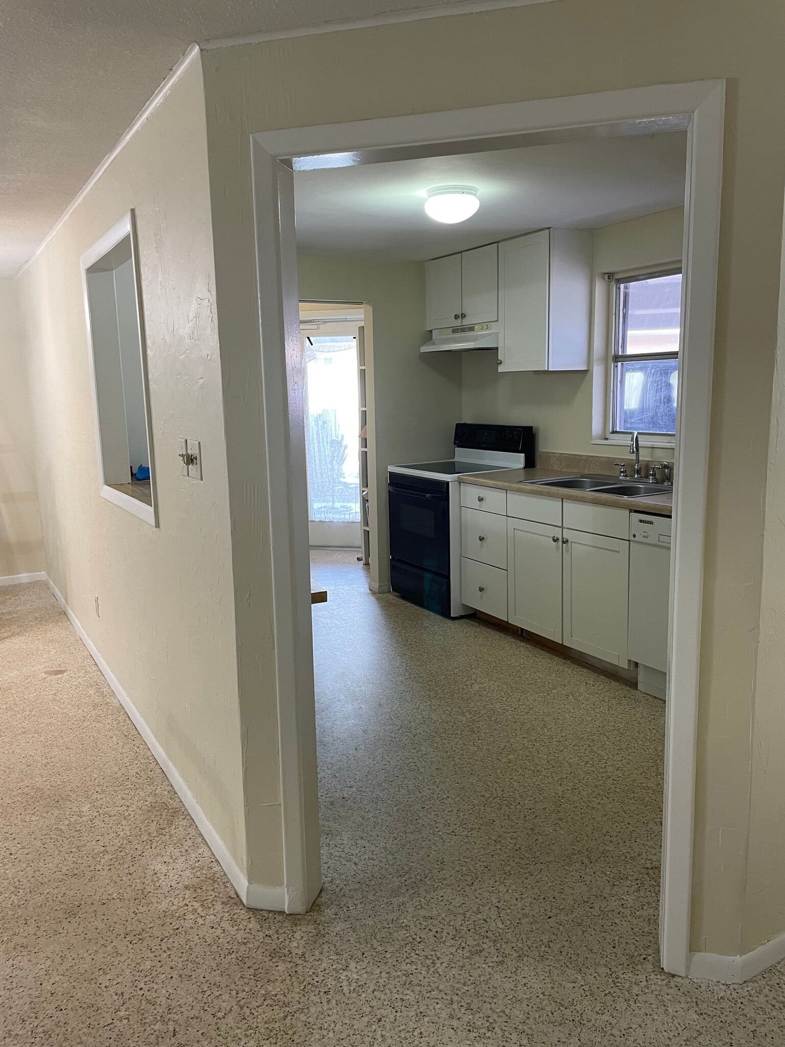 Kitchen with pass-thru window - 6300 Mosby Pl