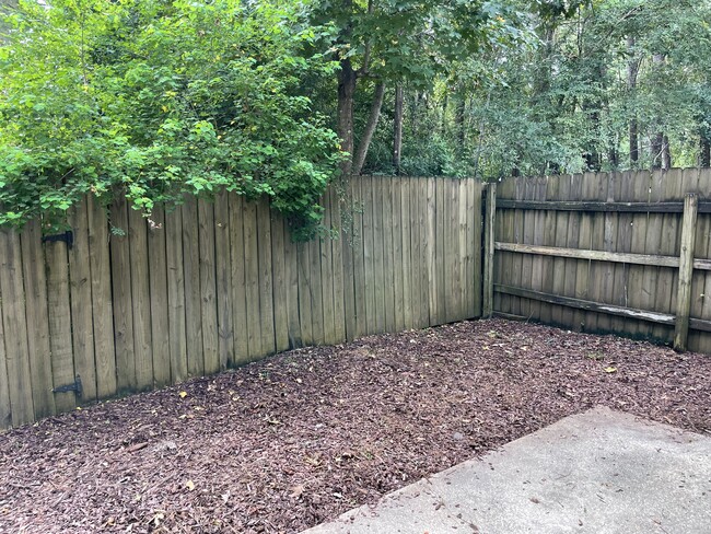 Small fenced back yard with patio - 716 Heavens Dr