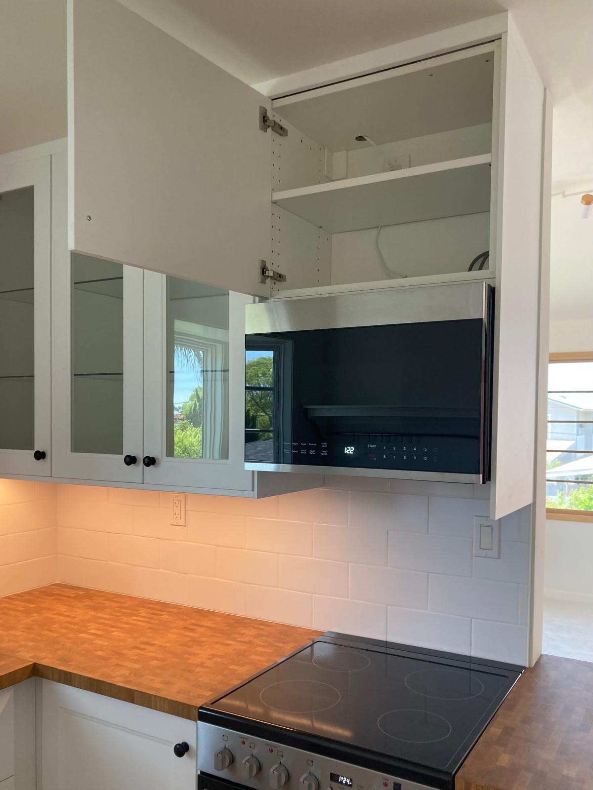 cabinets, lighting, microwave hood, storage - 624 Bonair St