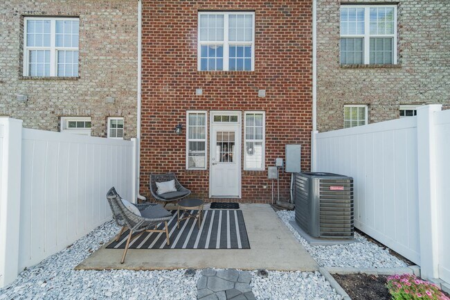 Building Photo - UPGRADES! Two Bedroom Townhouse - Six Mont...