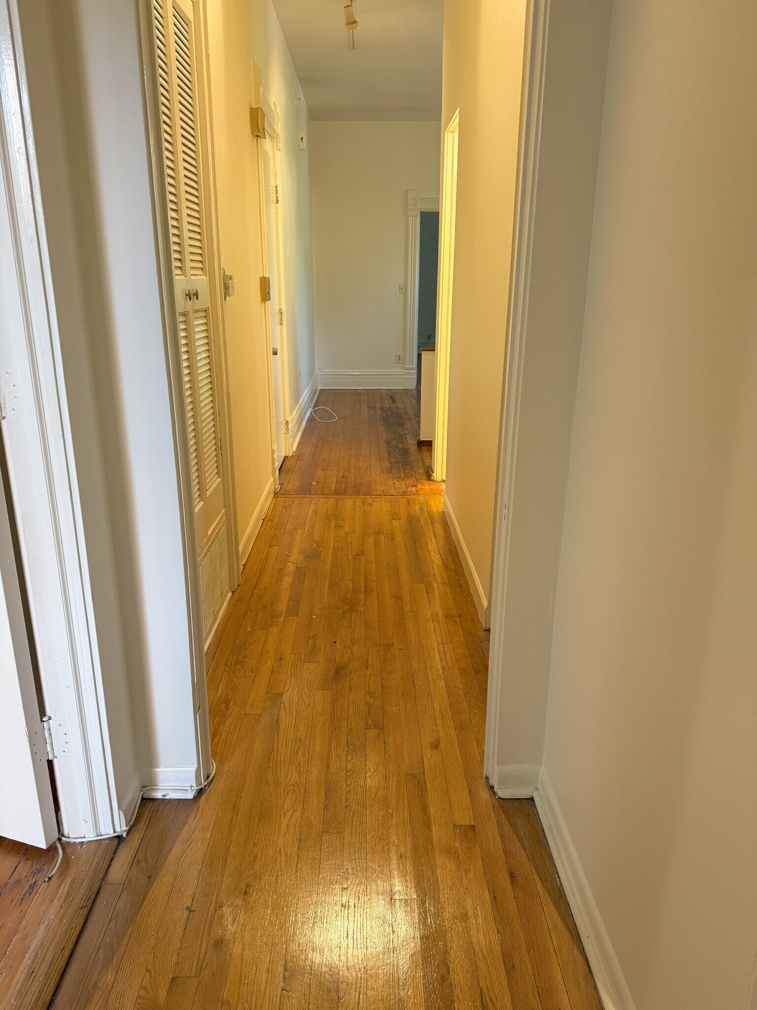 hallway with bathrooms and bedrooms - 2059 N Clifton Ave